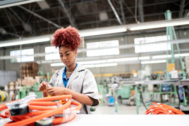 istock Young woman working in a factory 1195027675