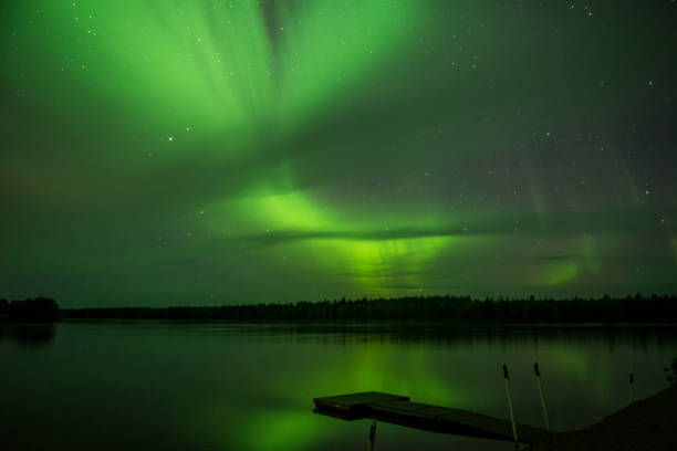 istock Northern lights above lake 1195035043