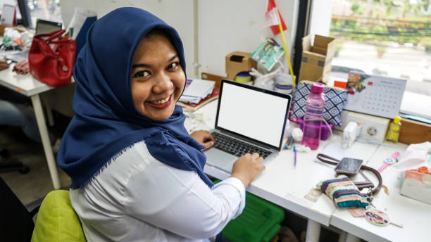 Asian Millennials Woman Hijab in Front of Laptop Stock Photo stock photo