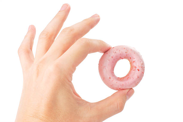 istock Lovely mini donut in man's hand 119504295