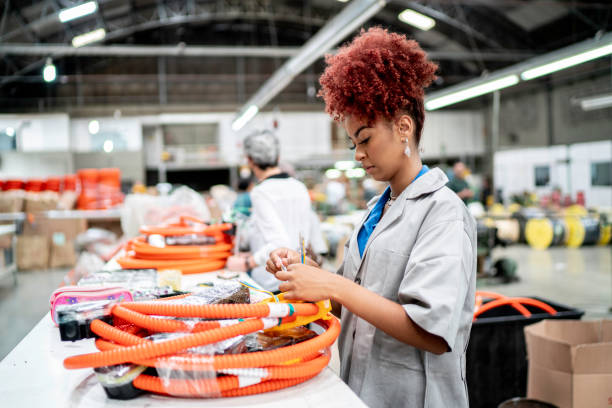 istock Young woman working in a factory 1195044104