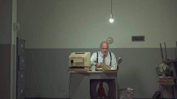 istock Sad businessman working in a small office 1195045247