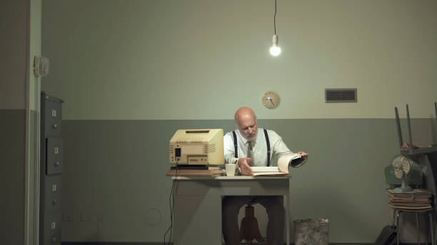 istock Sad businessman working in a small office 1195045267