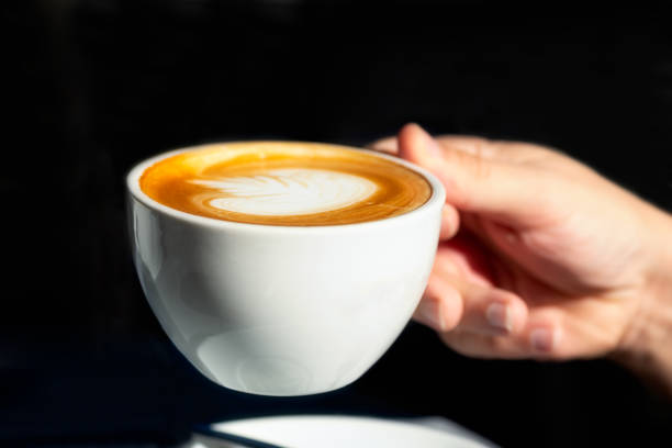 istock Flat white coffee on the table in the cafe 1195045500