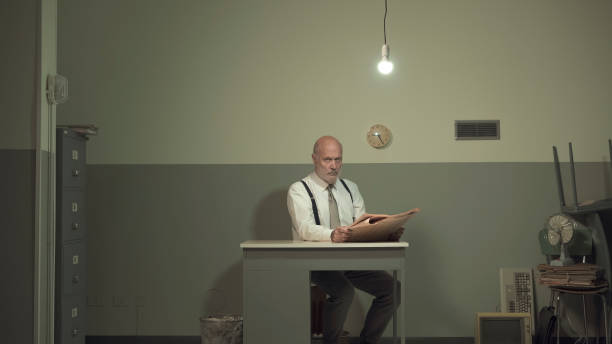 istock Bored businessman in his small office 1195045921