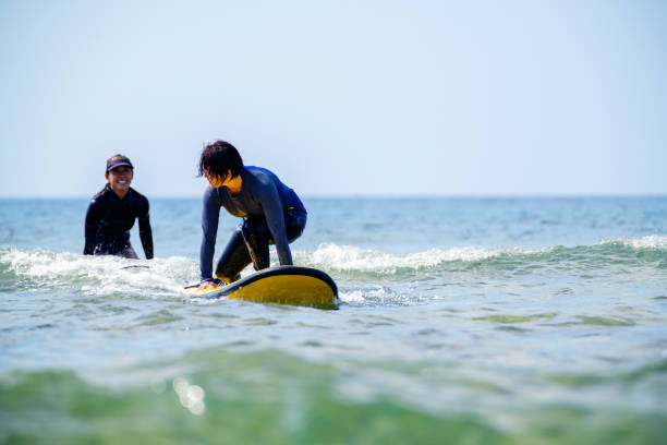 istock Mature woman taking a surfing lesson 1195045936