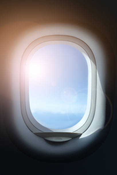 finestra dell'aereo. - window porthole sky cloudscape foto e immagini stock
