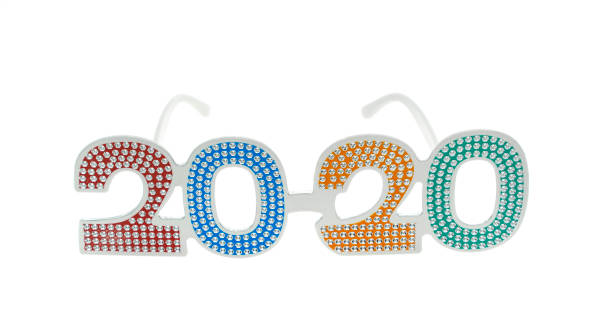 istock 2020 text with eye glasses for New Year Eve celebration on white background 1195050381