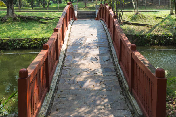 istock bridge from natural stone in the park 1195051329