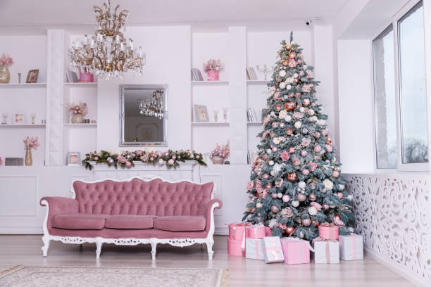 istock Beautiful Christmas tree decorated with toys and gift boxes 1195054551