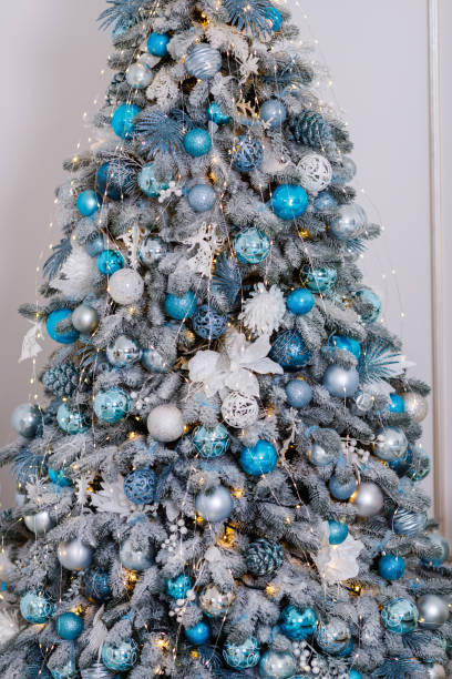 istock Beautiful Christmas tree decorated with toys and gift boxes 1195054580