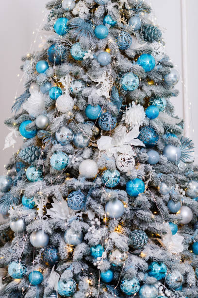 istock Beautiful Christmas tree decorated with toys and gift boxes 1195054720