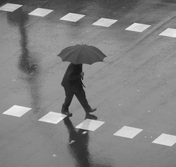 istock People walking in the rain 1195054979