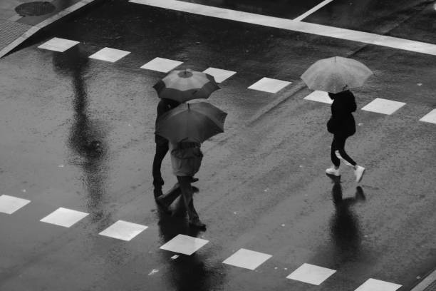 istock People walking in the rain 1195054995