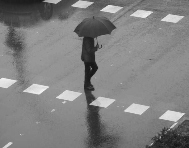 istock People walking in the rain 1195055009