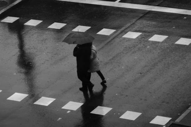 istock People walking in the rain 1195055013
