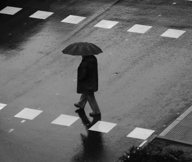 istock People walking in the rain 1195055017