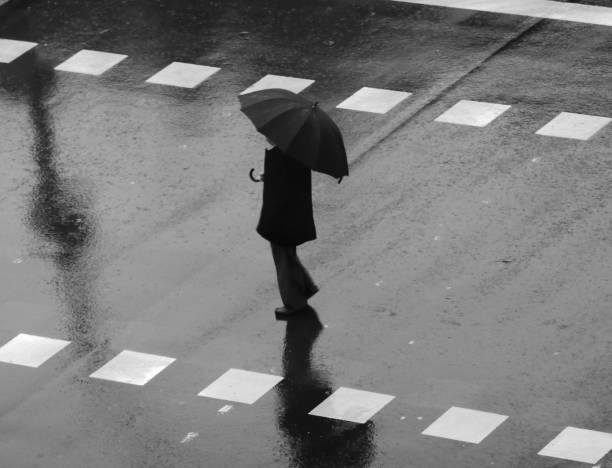 istock People walking in the rain 1195055021