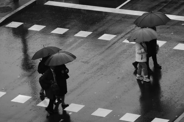 istock People walking in the rain 1195055025