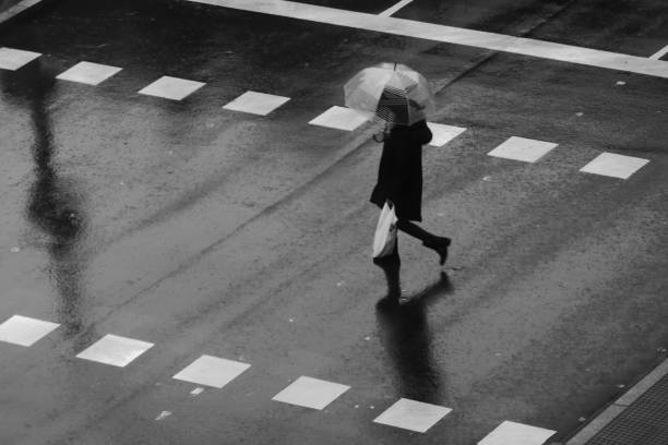 istock People walking in the rain 1195055034