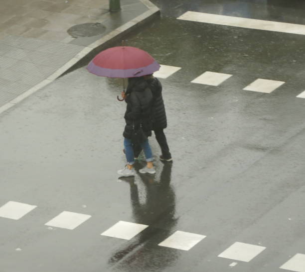 istock People walking in the rain 1195055035