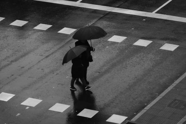 istock People walking in the rain 1195055071