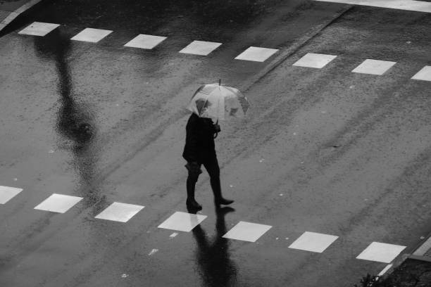 istock People walking in the rain 1195055074