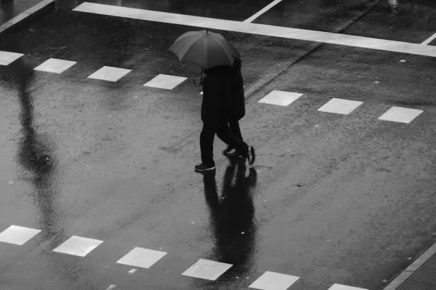 istock People walking in the rain 1195055075