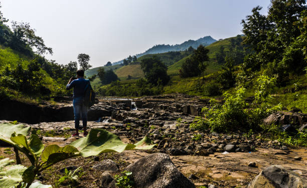 istock Adult man at Zarwani waterfall 1195055863