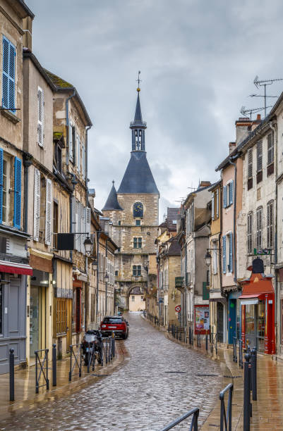 Street in Avallon, France Street with historical clock tower in Avallon, France avallon stock pictures, royalty-free photos & images