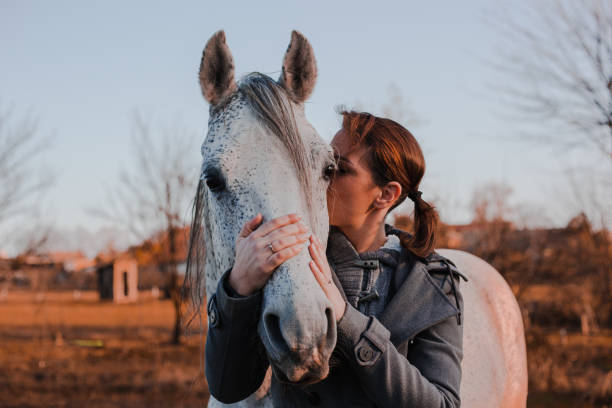 istock Women with horse 1195061809