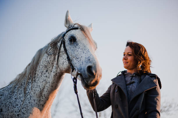 istock Women with horse 1195062207