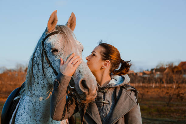 istock Women with horse 1195062294