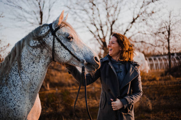 istock Women with horse 1195062525