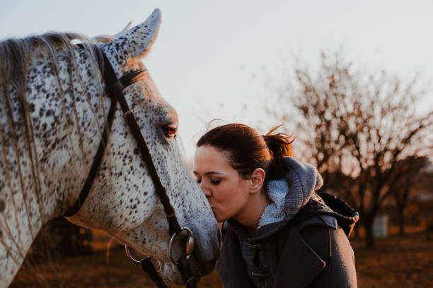 istock Women with horse 1195063176