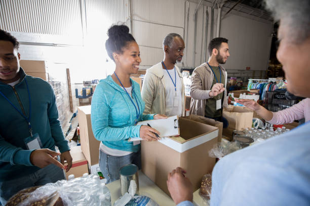 istock Cheerful group of volunteers working together 1195063594