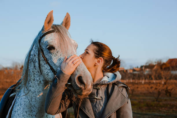 istock Women with horse 1195063696