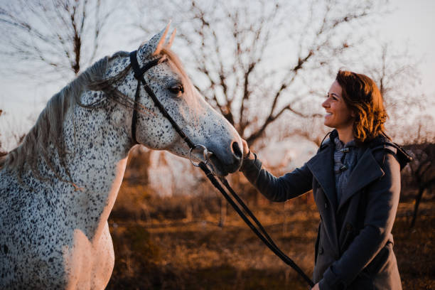 istock Women with horse 1195064526
