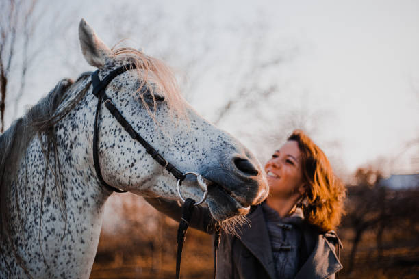 istock Women with horse 1195064903