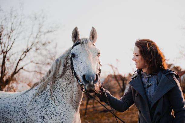 istock Women with horse 1195064986