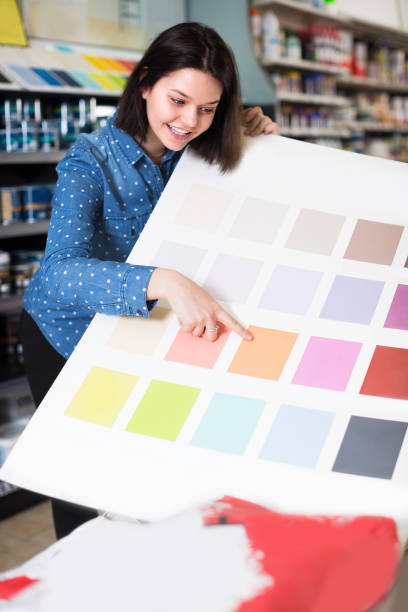 istock Young woman is deciding on best color scheme 1195067321