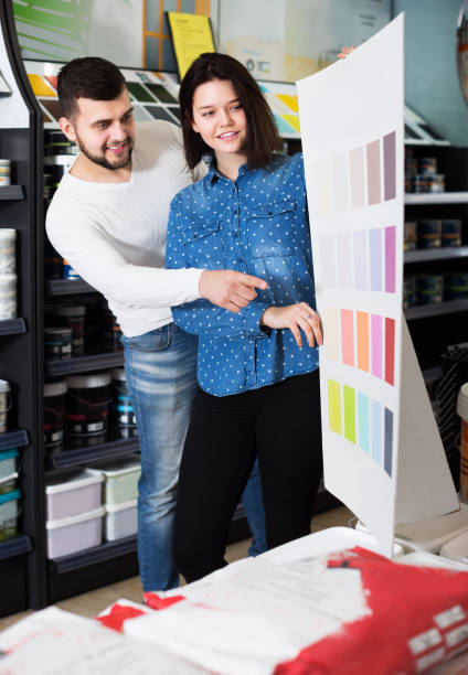 istock Couple in paint supplies store 1195067323
