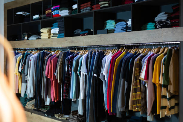 istock Assorted casual men clothes on shelves 1195070679