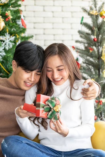 istock man giving girl christmas present 1195080881