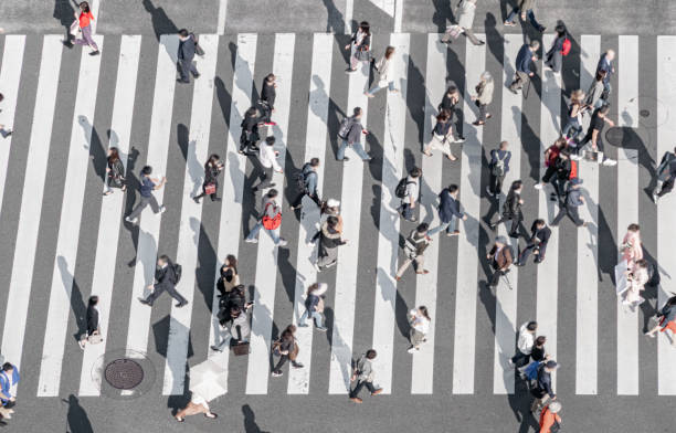 People crossing the street on walkway Tokyo Japan stock photo