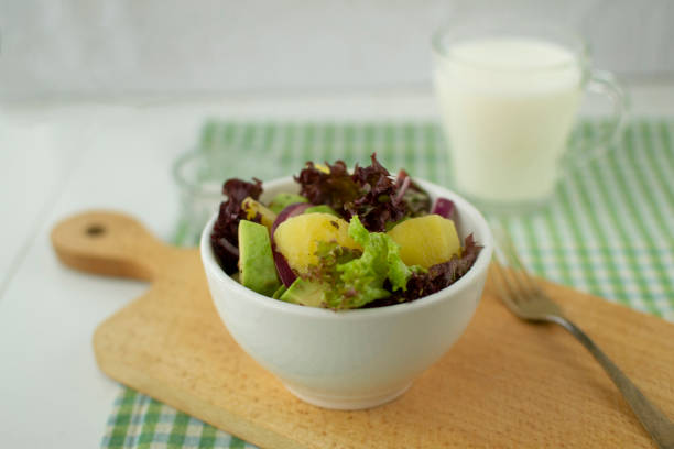 Dietary salad of potatoes, avocado and red onion