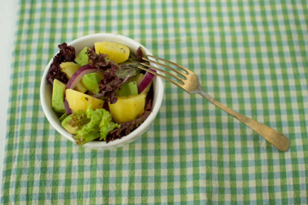 Dietary salad of potatoes, avocado and red onion