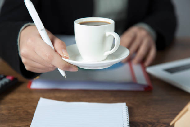 istock woman hand cup of coffee 1195085884