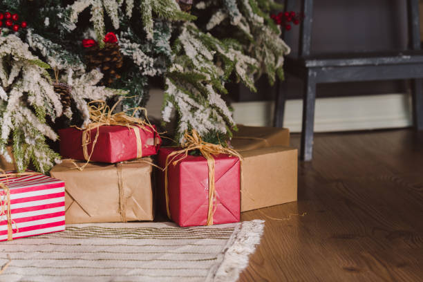 istock Christmas and New Year decorations with lights.Christmas tree and gift boxes left by santa claus 1195086320
