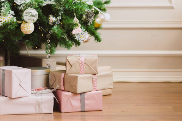 istock Christmas and New Year decorations with lights.Christmas tree and gift boxes left by santa claus 1195086327